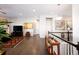 Open hallway with hardwood floors and a view to the living room at 7394 S Scottsburg Way, Aurora, CO 80016