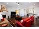 Spacious living room featuring hardwood floors and a fireplace at 7394 S Scottsburg Way, Aurora, CO 80016