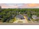 Aerial view showcasing property, mature trees, and city skyline beyond at 4645 E Florida Ave, Denver, CO 80222