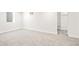 Spacious basement bedroom with ample lighting, closet, and soft carpet at 4645 E Florida Ave, Denver, CO 80222