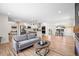 Open-concept living space with a modern kitchen, dining area, and comfortable seating at 4645 E Florida Ave, Denver, CO 80222