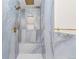 Stunning walk-in shower featuring luxurious blue marble-style tile, golden fixtures, and convenient recessed shelving at 4645 E Florida Ave, Denver, CO 80222