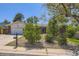 Charming single-story home with a well-maintained front yard with mature trees and a mailbox at 661 S Paris St, Aurora, CO 80012