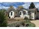 Charming single-story home with a garden and covered porch entrance at 75 Pierce St, Lakewood, CO 80226