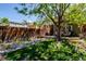 Spacious backyard with a lush lawn, a charming patio set, and a privacy fence, perfect for outdoor living and entertaining at 433 Fox St, Denver, CO 80204