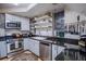 Efficient kitchen featuring modern stainless steel appliances, granite countertops, and ample storage at 433 Fox St, Denver, CO 80204
