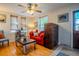 Bright living room with hardwood floors, a red sofa, and lots of natural light at 433 Fox St, Denver, CO 80204