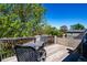 Charming rooftop deck with outdoor seating, surrounded by lush greenery, offering a tranquil escape and city views at 433 Fox St, Denver, CO 80204