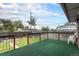 Relaxing back deck with a view of the green backyard and blue sky at 7644 Wyandot St, Denver, CO 80221