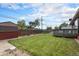 Lush backyard with a deck, manicured lawn, and a storage shed, perfect for outdoor living at 7644 Wyandot St, Denver, CO 80221