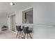 Cozy bar area featuring black leather bar stools and open view to the kitchen at 7644 Wyandot St, Denver, CO 80221