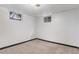 Unfinished basement space with two windows for natural light at 7644 Wyandot St, Denver, CO 80221