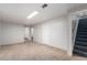 Spacious finished basement with new carpet, lots of open space, and easy access to stairs at 7644 Wyandot St, Denver, CO 80221