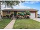 Charming brick home with a well-maintained lawn and unique landscaping at 7644 Wyandot St, Denver, CO 80221