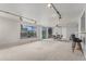 Expansive living room with access to the backyard and an open dining area at 7644 Wyandot St, Denver, CO 80221