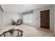Inviting living room with neutral carpet and bright natural light at 7644 Wyandot St, Denver, CO 80221