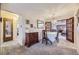 Charming dining room with a round table set for dinner, chandelier, and adjacent living area at 170 S Fenton St, Lakewood, CO 80226