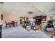 Spacious living room features plush carpet, ceiling fan, and entertainment center at 170 S Fenton St, Lakewood, CO 80226