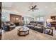 Spacious living room with cozy seating, brick fireplace, and a ceiling fan at 170 S Fenton St, Lakewood, CO 80226