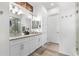 Elegant bathroom with double vanity, granite countertops, and modern lighting at 5597 Pinto Valley St, Parker, CO 80134