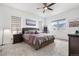 Cozy bedroom with large windows, ceiling fan, and comfortable furnishings at 5597 Pinto Valley St, Parker, CO 80134