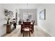 Formal dining room with wooden table, chandelier, and neutral décor at 5597 Pinto Valley St, Parker, CO 80134