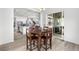 Open concept dining room with hardwood flooring and views to the kitchen at 5597 Pinto Valley St, Parker, CO 80134