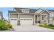 Charming two-story home featuring a three-car garage and stone accents at 5597 Pinto Valley St, Parker, CO 80134