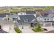 Beautiful home with a three-car garage, stone accents, and meticulously landscaped front yard at 5597 Pinto Valley St, Parker, CO 80134