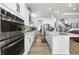Bright and spacious kitchen featuring a full suite of stainless steel appliances at 5597 Pinto Valley St, Parker, CO 80134