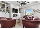Inviting living room with built-ins, fireplace, and view of the outdoors at 5597 Pinto Valley St, Parker, CO 80134