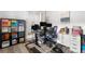 Office area featuring a large desk, storage cabinets, work space, and a view to the hallway at 5597 Pinto Valley St, Parker, CO 80134