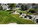Overhead view of manicured community green space including putting green, green grass and walking paths at 7172 S Vine Cir, Centennial, CO 80122