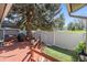 Inviting backyard featuring a wooden deck, an artificial turf area, and privacy fencing at 7172 S Vine Cir, Centennial, CO 80122