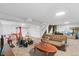 Spacious finished basement with carpet, recessed lights, neutral paint and a brown sofa at 7172 S Vine Cir, Centennial, CO 80122