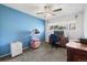 Bedroom featuring a ceiling fan, large window, desk, and carpeted flooring at 7172 S Vine Cir, Centennial, CO 80122