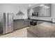 The kitchen features granite countertops, stainless steel appliances, and wood-style flooring at 7172 S Vine Cir, Centennial, CO 80122