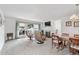 Bright living room with large window, fireplace, and dining area at 7172 S Vine Cir, Centennial, CO 80122