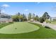 A putting green offers golf enthusiasts the opportunity to practice their short game in a tranquil setting at 7172 S Vine Cir, Centennial, CO 80122