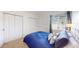 Bright bedroom featuring plush carpeting, and white closets, creating a cozy and inviting atmosphere at 3600 S Pierce St # 5-202, Denver, CO 80235