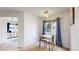Quaint dining area features a window and is adjacent to another room at 3600 S Pierce St # 5-202, Denver, CO 80235