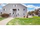 Beautifully designed building showcasing mature landscaping with well manicured lawns at 3600 S Pierce St # 5-202, Denver, CO 80235