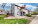 Exterior view of a building with a well-maintained landscape, showcasing the outdoor living at 3600 S Pierce St # 5-202, Denver, CO 80235