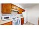 Efficient kitchen featuring classic appliances and wood cabinets at 3600 S Pierce St # 5-202, Denver, CO 80235