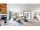 Cozy living room with vaulted ceiling, comfortable seating, and access to the outside at 3600 S Pierce St # 5-202, Denver, CO 80235