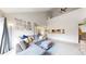 Inviting living room boasting tall ceilings and seamless flow to the kitchen area at 3600 S Pierce St # 5-202, Denver, CO 80235