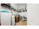 Walk-in storage area with shelving units, and a water heater, maximizing space at 3600 S Pierce St # 5-202, Denver, CO 80235