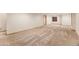 Expansive basement with plush carpeting, trim, and a window for natural light at 9346 Lark Sparrow Dr, Highlands Ranch, CO 80126