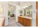 Bright bathroom featuring double sinks, and a spacious, open layout for comfortable use at 9346 Lark Sparrow Dr, Highlands Ranch, CO 80126