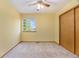 Bright bedroom with a ceiling fan, natural light from the window, and a closet at 9346 Lark Sparrow Dr, Highlands Ranch, CO 80126